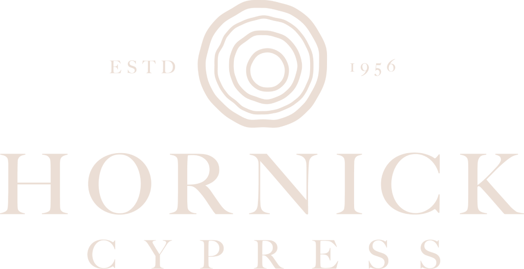 Logo for Hornick Cypress featuring concentric circles resembling tree rings above the text "ESTD 1956" and the words "HORNICK CYPRESS" in large, elegant letters. The design uses a light, minimalist style.